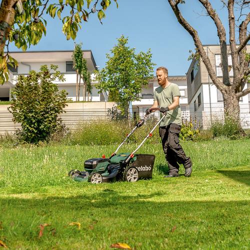 Naked Man Mowing The Lawn